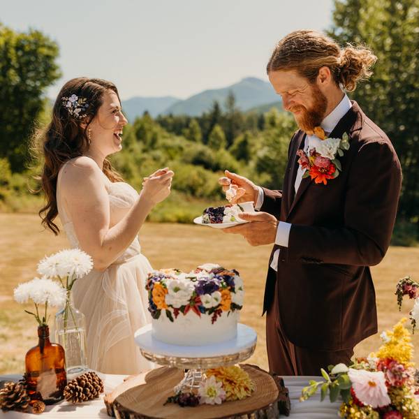 happy couple with ccs cake.jpg
